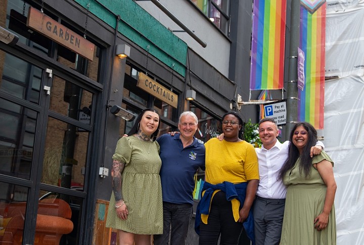 Birmingham City Council leader Ian Ward (second from left) at Pride House with Lawrence Barton (second from right)