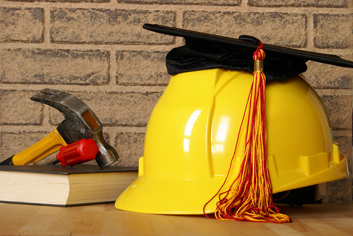 A concept of tradesman building their skills through successful completion of proper education.  M